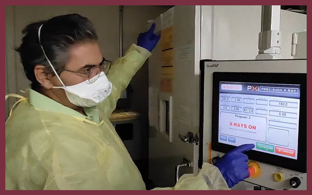 Akash Gunjan working on X-ray machine.