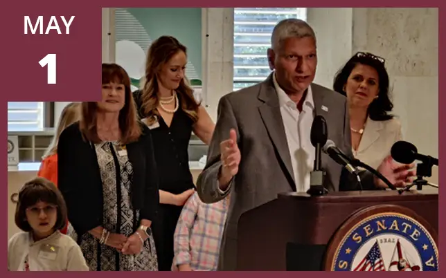 Pradeep Bhide speaking at the Florida capitol about Prader-Willi Syndrome with the text "MAY 1."