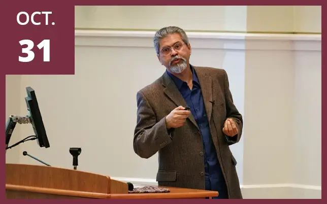 A researcher is shown giving a formal presentation.