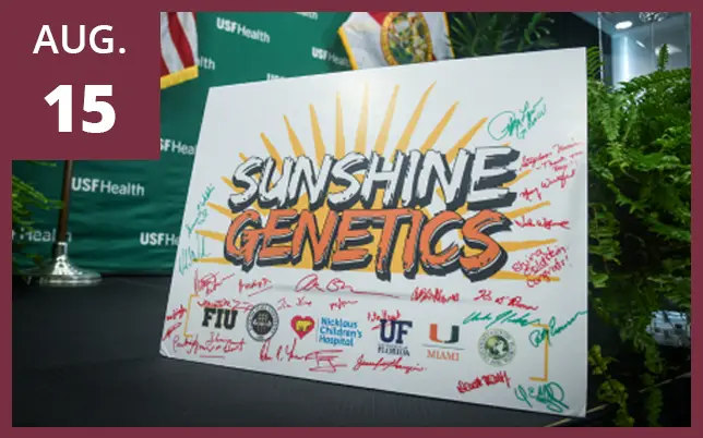 A commemorative poster for the Sunshine Genetics initiative, signed by various individuals and featuring the logos of partner institutions including FIU, Florida State University, Nicklaus Children's Hospital, UF, University of Miami, and USF Health. A maroon box in the top-left corner features the text 