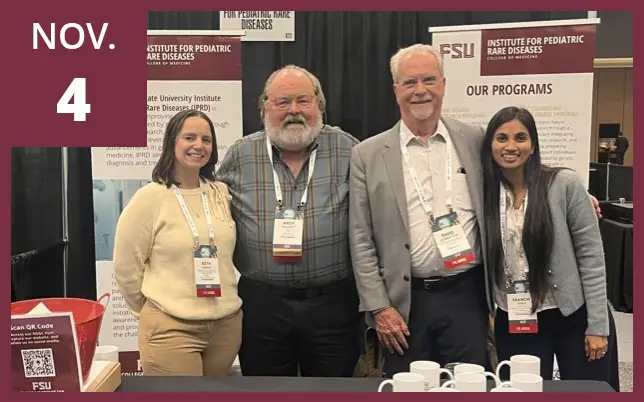 Four individuals stand together at an FSU Institute for Pediatric Rare Diseases booth during an event on November 4th.