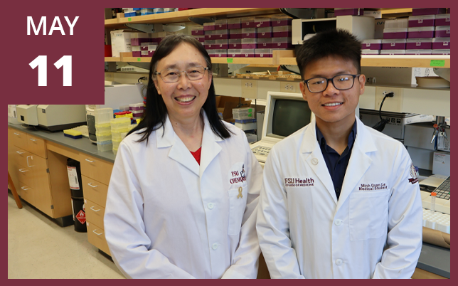 two smiling researchers wearing FSU white lab coats inside a laboratory setting, with a maroon box in the top-left corner displaying the text "MAY 11".